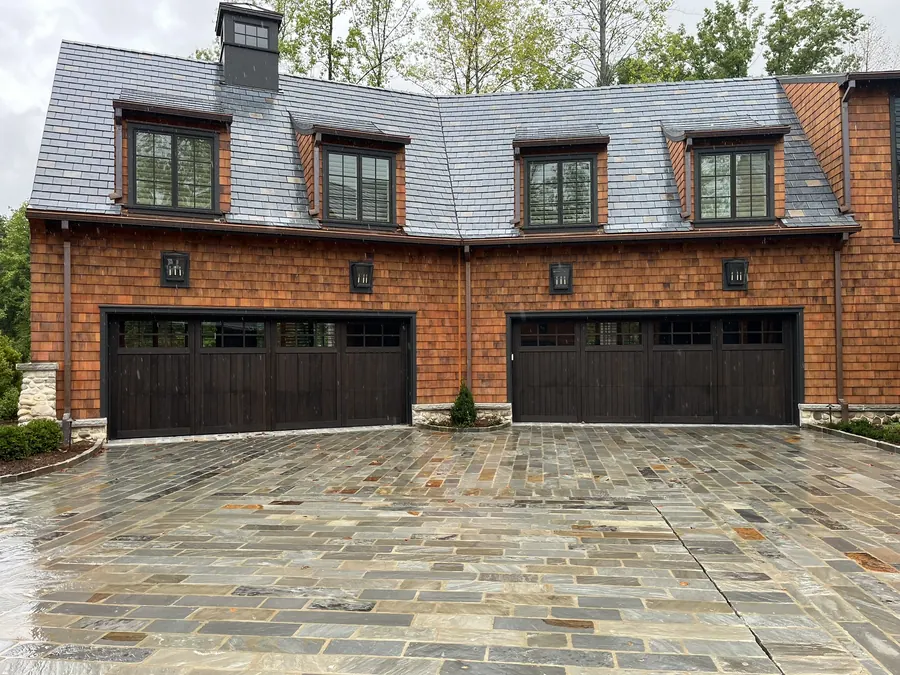 Custom wood-look garage door installation by Blackstone